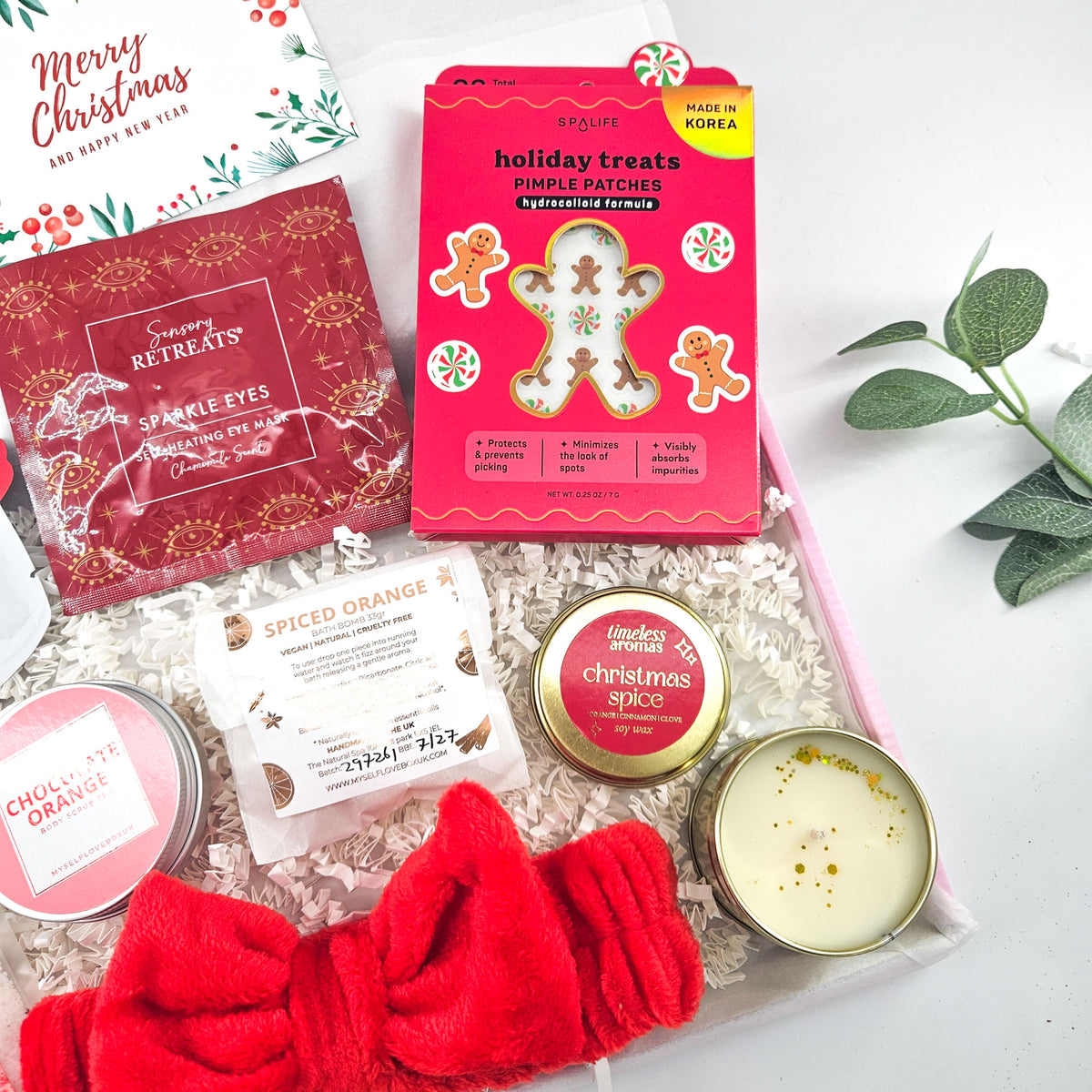 Christmas beauty gift featuring SpaLife gingerbread pimple patches, nourishing facial mask and Sensory Retreats self-heating eye mask