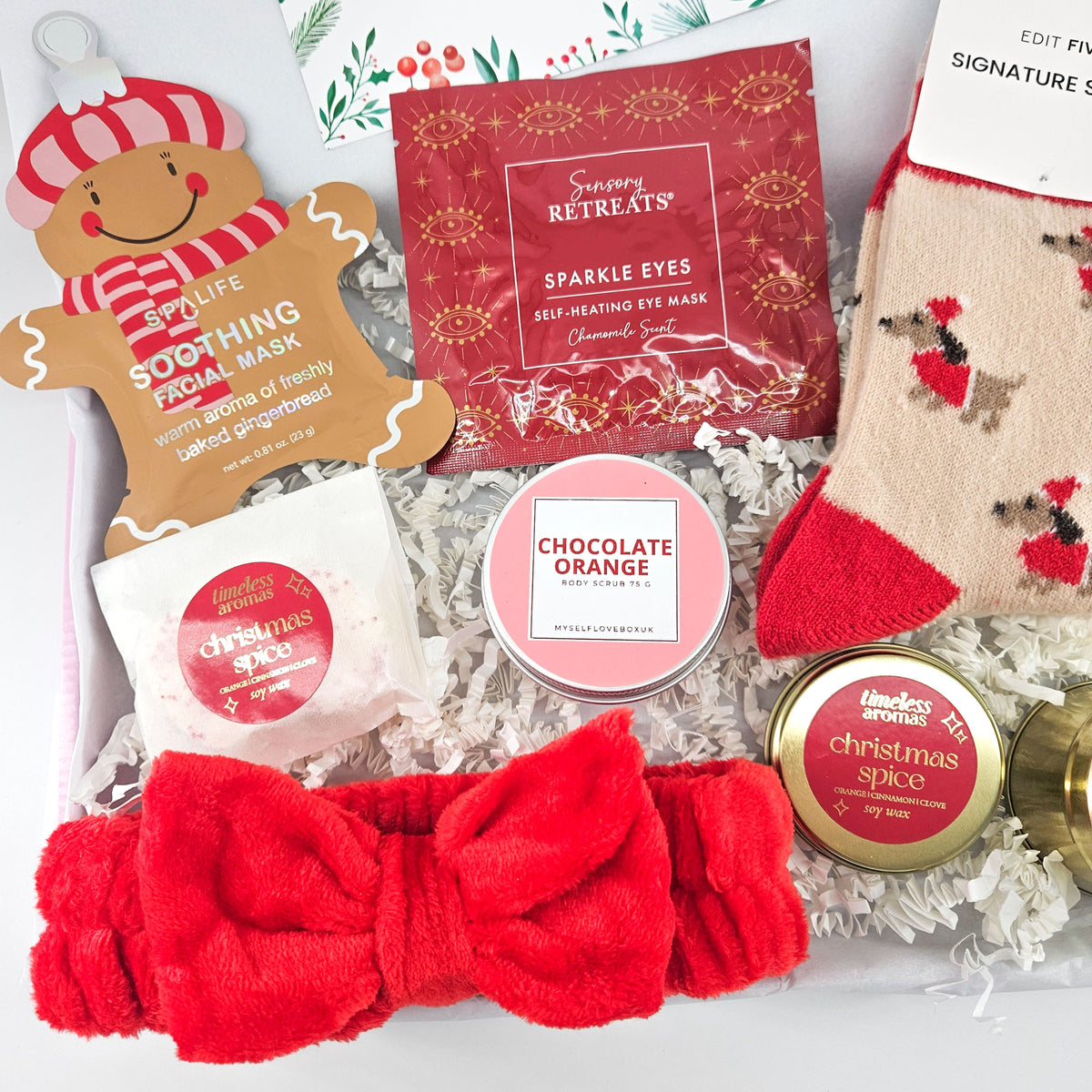 Christmas care package with SpaLife gingerbread facial mask, Sensory Retreats eye mask, chocolate orange body scrub and Christmas Spice wax melts