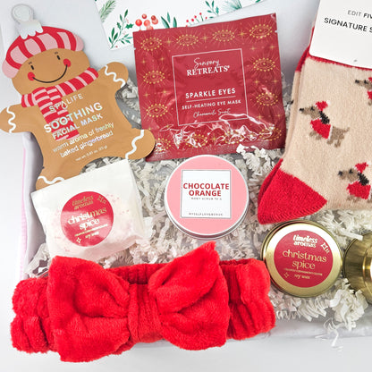 Christmas care package with SpaLife gingerbread facial mask, Sensory Retreats eye mask, chocolate orange body scrub and Christmas Spice wax melts