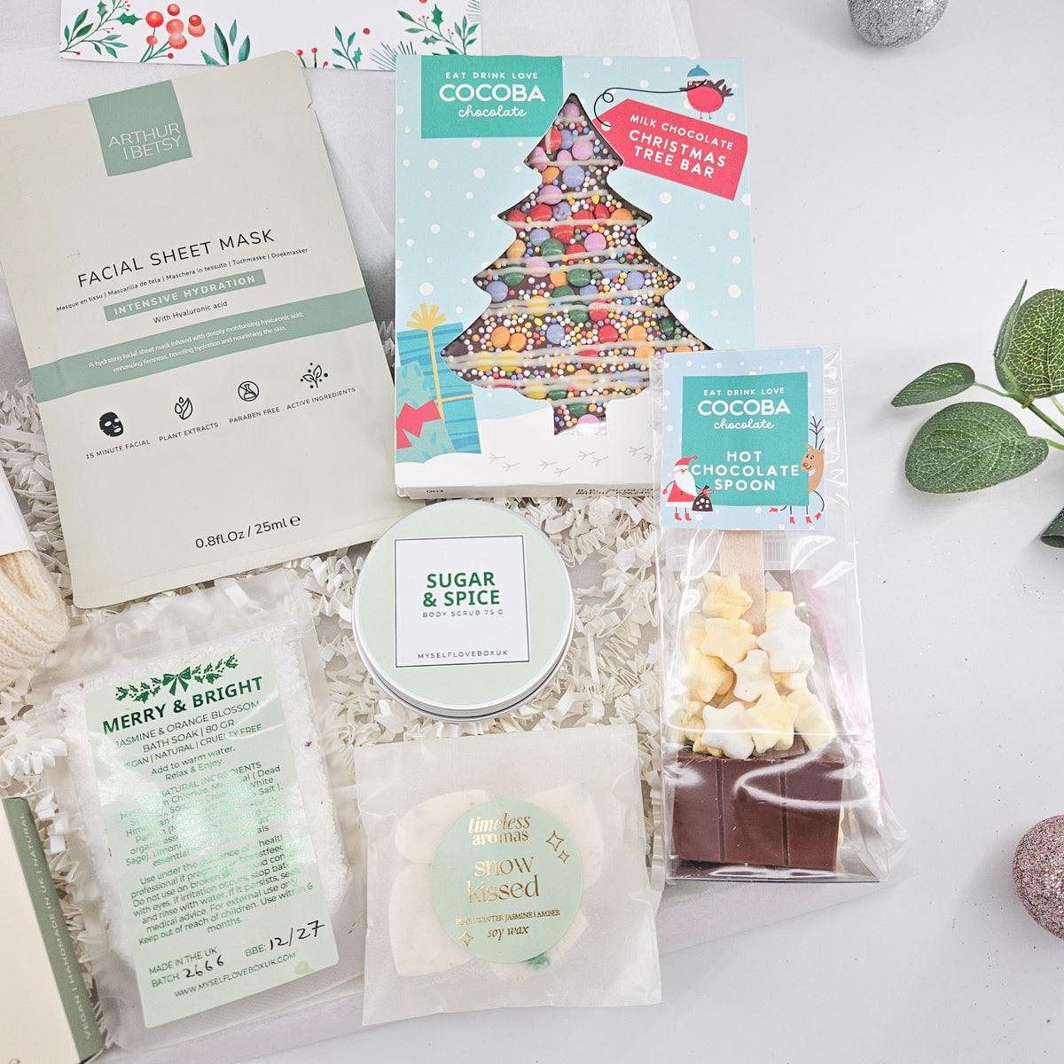 Christmas pamper gift for her with Arthur Betsy sheet mask, bath salts, body scrub, hot chocolate and cosy socks