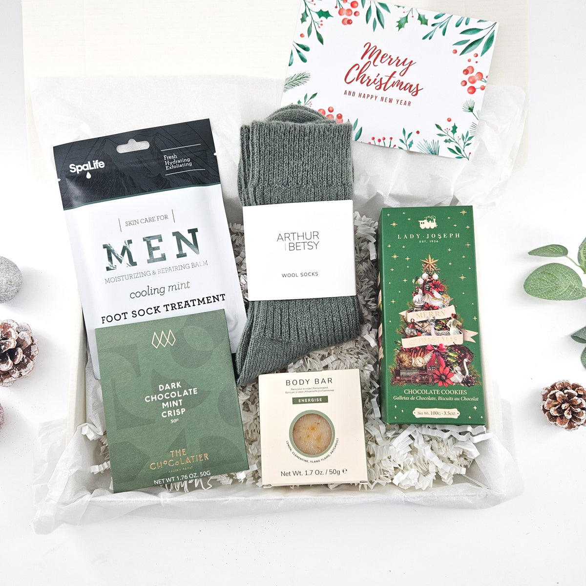 Cosy Christmas gift box for him with wool socks, chocolate, festive biscuits and men's grooming treats