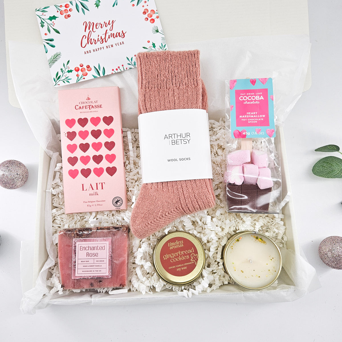 Cosy Christmas pamper gift box for her with pink wool socks, Belgian chocolate, hot chocolate, handmade soap and gingerbread candle