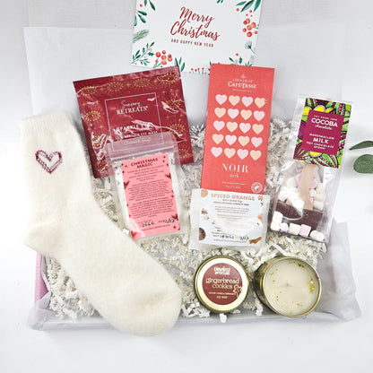 Festive Indulgence Christmas pamper hamper with fluffy heart socks, Belgian chocolate, hot chocolate spoon, bath treats and gingerbread candle