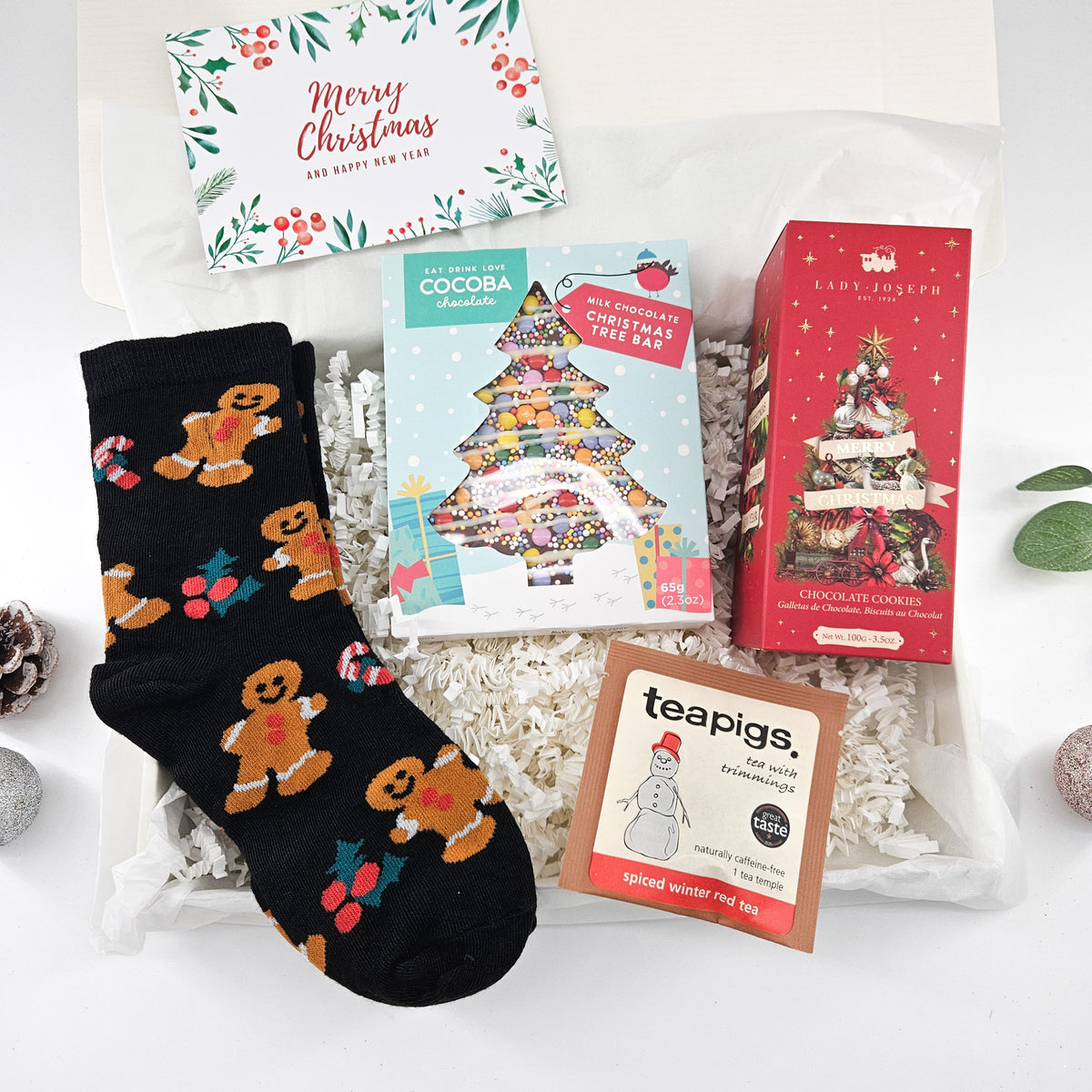 Gingerbread Christmas treat box with festive socks, Cocoba chocolate Christmas tree, Lady Joseph biscuits and winter tea
