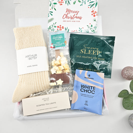 Winter Warmth Gift Box with cream wool socks, Cocoba hot chocolate spoon, Sensory Sleep eye mask, white chocolate drink and scented tea lights